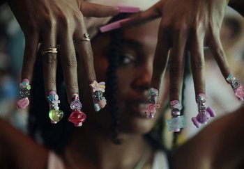 Movie still from “AJ Tracey - Bubble Bath” (2024), directed by Late Milk – Extreme Close Up shot, High angle