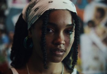 Movie still from “AJ Tracey - Bubble Bath” (2024), directed by Late Milk – Close Up shot, Over the shoulder angle