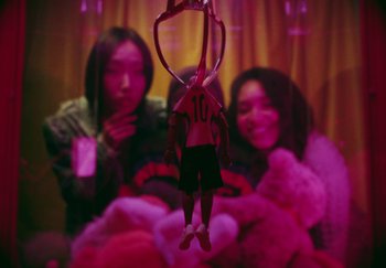 Movie still from “AJ Tracey - Bubble Bath” (2024), directed by Late Milk – Extreme Close Up shot, High angle