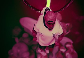 Movie still from “AJ Tracey - Bubble Bath” (2024), directed by Late Milk – Extreme Close Up shot, Overhead angle