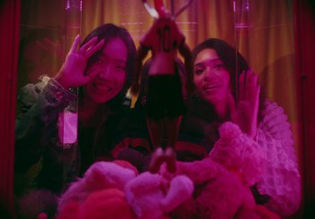 Movie still from “AJ Tracey - Bubble Bath” (2024), directed by Late Milk – Medium shot, High angle