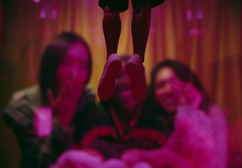 Movie still from “AJ Tracey - Bubble Bath” (2024), directed by Late Milk – Extreme Close Up shot, Low angle