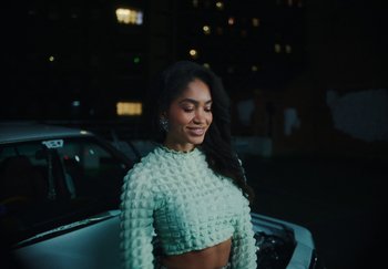 Movie still from “AJ Tracey - Bubble Bath” (2024), directed by Late Milk – Medium shot, Low angle