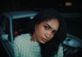 Movie still from “AJ Tracey - Bubble Bath” (2024), directed by Late Milk – Close Up shot, Low angle