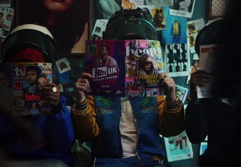 Movie still from “AJ Tracey - Bubble Bath” (2024), directed by Late Milk – Medium shot, High angle