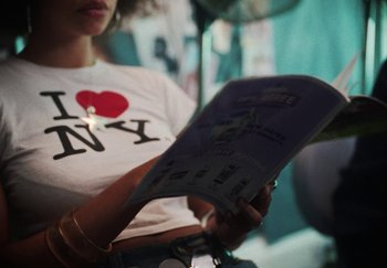 Movie still from “AJ Tracey - Bubble Bath” (2024), directed by Late Milk – Close Up shot, High angle