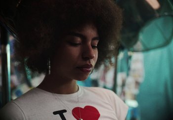 Movie still from “AJ Tracey - Bubble Bath” (2024), directed by Late Milk – Close Up shot, Low angle