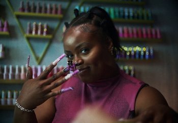 Movie still from “AJ Tracey - Bubble Bath” (2024), directed by Late Milk – Close Up shot, Low angle