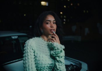 Movie still from “AJ Tracey - Bubble Bath” (2024), directed by Late Milk – Close Up shot, Low angle