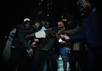 Movie still from “AJ Tracey - Bubble Bath” (2024), directed by Late Milk – Wide shot, High angle