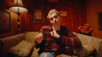 Movie still from “Conswank - Holes In My Denim” (2023), directed by Seamus Brennan – Medium shot, Low angle