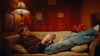Movie still from “Conswank - Holes In My Denim” (2023), directed by Seamus Brennan – Medium shot, High angle