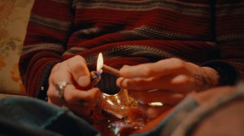 Movie still from “Conswank - Holes In My Denim” (2023), directed by Seamus Brennan – Extreme Close Up shot, Overhead angle