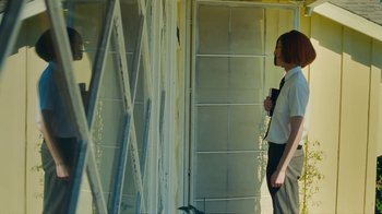 Movie still from “Sub Urban feat. BENEE - UH OH!” (2022), directed by Andrew Donoho – Medium shot, Low angle