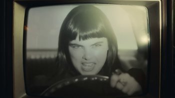 Movie still from “Sub Urban feat. BENEE - UH OH!” (2022), directed by Andrew Donoho – Extreme Close Up shot, Low angle