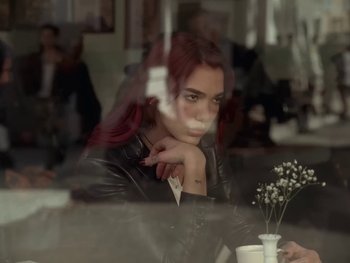 Movie still from “Dua Lipa - Training Season” (2024), directed by Vincent Haycock – Medium shot, Over the shoulder angle