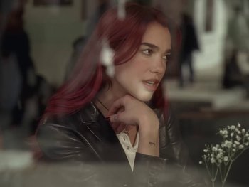 Movie still from “Dua Lipa - Training Season” (2024), directed by Vincent Haycock – Close Up shot, Over the shoulder angle