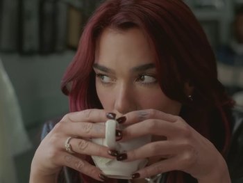 Movie still from “Dua Lipa - Training Season” (2024), directed by Vincent Haycock – Close Up shot, High angle