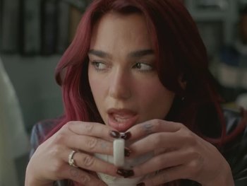 Movie still from “Dua Lipa - Training Season” (2024), directed by Vincent Haycock – Close Up shot, High angle