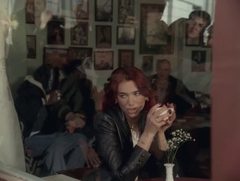 Movie still from “Dua Lipa - Training Season” (2024), directed by Vincent Haycock – Medium shot, Over the shoulder angle