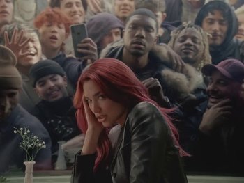 Movie still from “Dua Lipa - Training Season” (2024), directed by Vincent Haycock – Medium shot, High angle