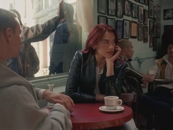 Movie still from “Dua Lipa - Training Season” (2024), directed by Vincent Haycock – Medium shot, Over the shoulder angle