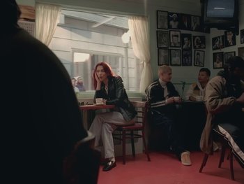 Movie still from “Dua Lipa - Training Season” (2024), directed by Vincent Haycock – Medium shot, Over the shoulder angle