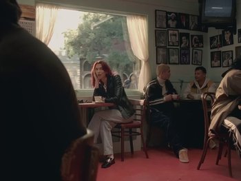 Movie still from “Dua Lipa - Training Season” (2024), directed by Vincent Haycock – Medium shot, Over the shoulder angle
