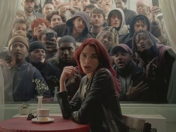 Movie still from “Dua Lipa - Training Season” (2024), directed by Vincent Haycock – Medium shot, Low angle