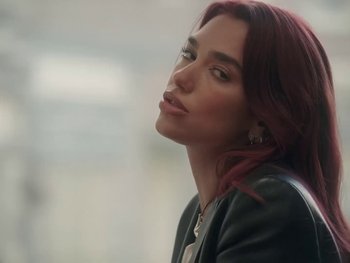 Movie still from “Dua Lipa - Training Season” (2024), directed by Vincent Haycock – Close Up shot, Low angle