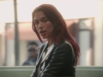 Movie still from “Dua Lipa - Training Season” (2024), directed by Vincent Haycock – Close Up shot, Low angle