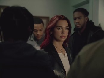 Movie still from “Dua Lipa - Training Season” (2024), directed by Vincent Haycock – Medium shot, Over the shoulder angle