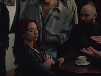 Movie still from “Dua Lipa - Training Season” (2024), directed by Vincent Haycock – Medium shot, Over the shoulder angle