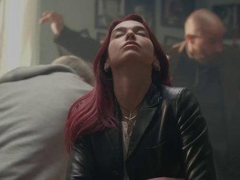 Movie still from “Dua Lipa - Training Season” (2024), directed by Vincent Haycock – Medium shot, Low angle