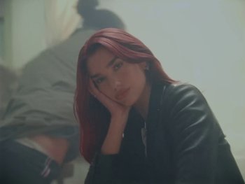 Movie still from “Dua Lipa - Training Season” (2024), directed by Vincent Haycock – Medium shot, Over the shoulder angle