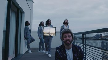 Movie still from “AJR - The DJ Is Crying For Help” (2022), directed by Austin Roa – Wide shot, High angle