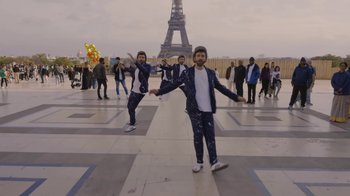 Movie still from “AJR - The DJ Is Crying For Help” (2022), directed by Austin Roa – Extreme Wide shot, Low angle