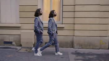 Movie still from “AJR - The DJ Is Crying For Help” (2022), directed by Austin Roa – Wide shot, Low angle