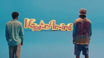 Movie still from “KAYTRAMINÉ feat. Pharrell Williams - 4EVA” (2023), directed by Jack Begert – Medium shot, Low angle