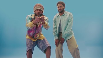 Movie still from “KAYTRAMINÉ feat. Pharrell Williams - 4EVA” (2023), directed by Jack Begert – Medium shot, Low angle