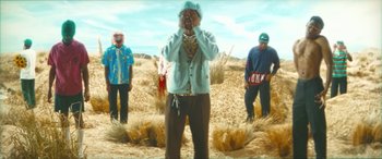 Movie still from “Tyler, The Creator - SORRY NOT SORRY” (2023), directed by Tyler Okonma – Medium shot, Low angle