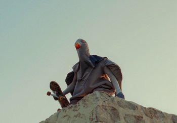 Movie still from “Miel De Montagne - Le Pigeon” (2023), directed by Morgan Jouquand – Medium shot, Low angle