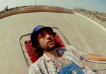 Movie still from “Miel De Montagne - Le Pigeon” (2023), directed by Morgan Jouquand – Medium shot, Overhead angle
