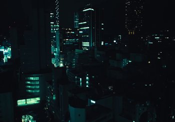 Movie still from “AJ Tracey - Wifey Riddim 4” (2024), directed by Late Milk – Extreme Wide shot, High angle