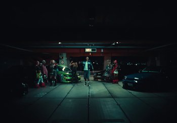 Movie still from “AJ Tracey - Wifey Riddim 4” (2024), directed by Late Milk – Wide shot, High angle