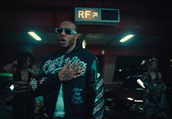 Movie still from “AJ Tracey - Wifey Riddim 4” (2024), directed by Late Milk – Medium shot, Low angle