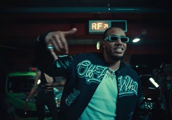 Movie still from “AJ Tracey - Wifey Riddim 4” (2024), directed by Late Milk – Medium shot, Low angle