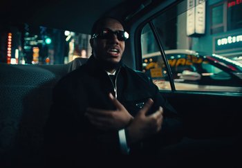 Movie still from “AJ Tracey - Wifey Riddim 4” (2024), directed by Late Milk – Close Up shot, Low angle