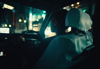 Movie still from “AJ Tracey - Wifey Riddim 4” (2024), directed by Late Milk – Medium shot, Over the shoulder angle