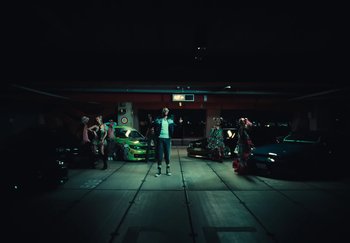 Movie still from “AJ Tracey - Wifey Riddim 4” (2024), directed by Late Milk – Wide shot, High angle